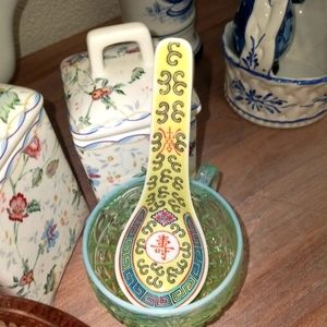 Set of 3 porcelain soup spoons, approx 5.5 inches long, yellow background